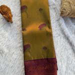 The Radiant Tapestry in Sheen green & Magenta with floral motifs